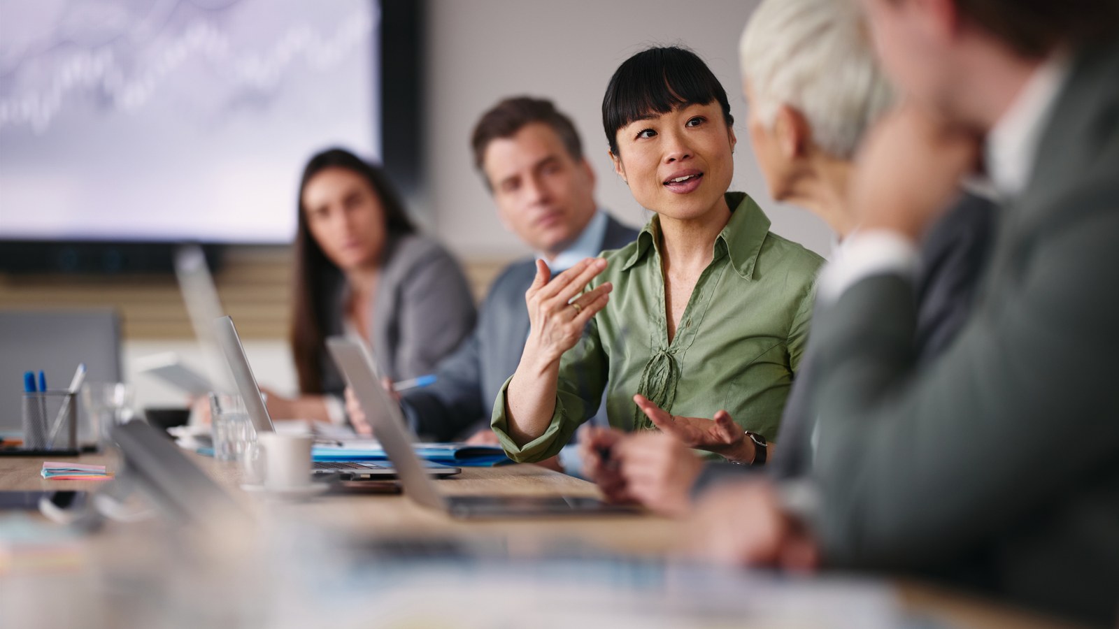 PCL IT leadership in a working session — mid-conversation, mixed seniority